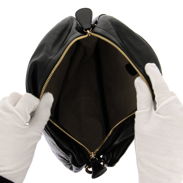 Sac rond noir en cuir