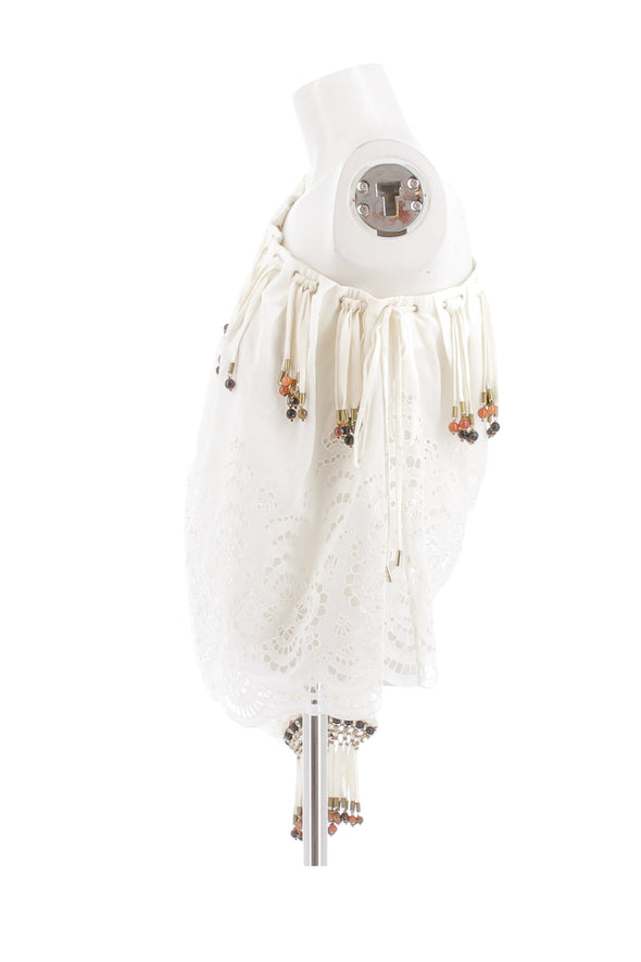 Top blanc et perles