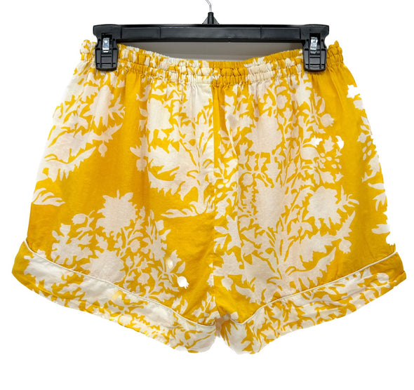 Short jaune à fleurs blanches