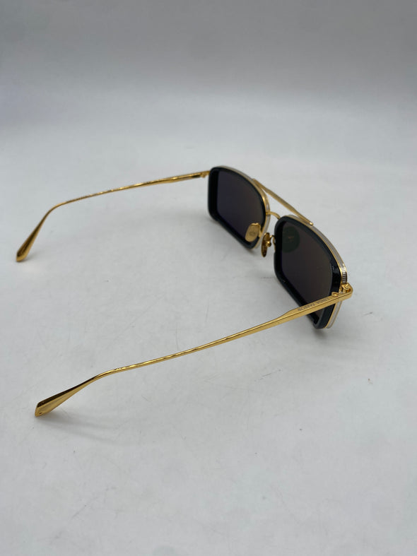 Lunettes de soleil noires et dorées