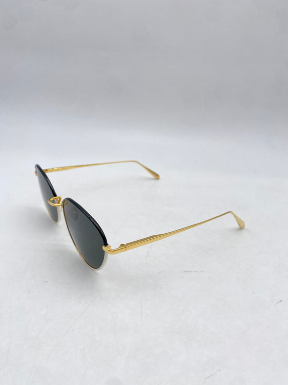 Lunettes de soleil blanches et dorées