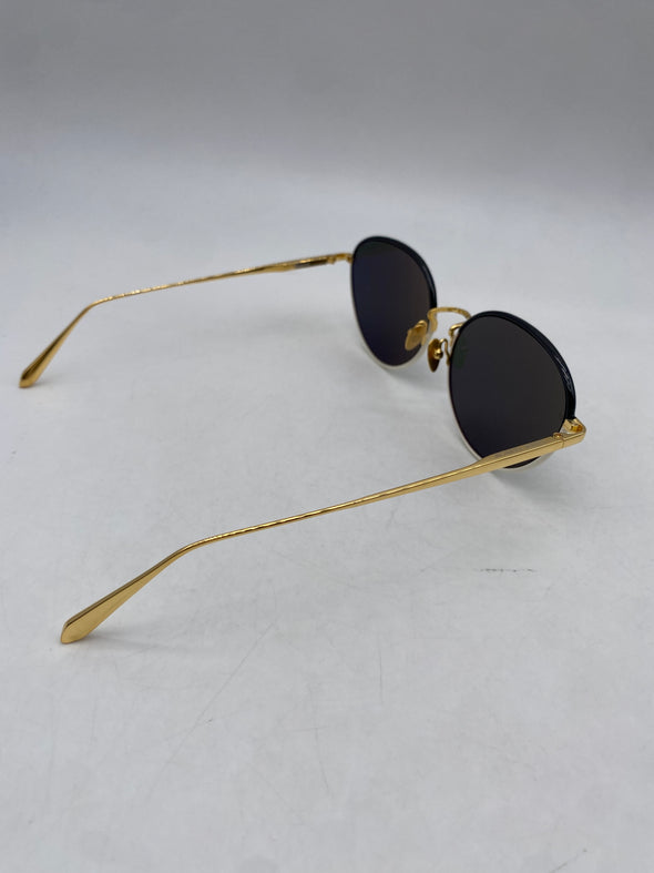 Lunettes de soleil blanches et dorées