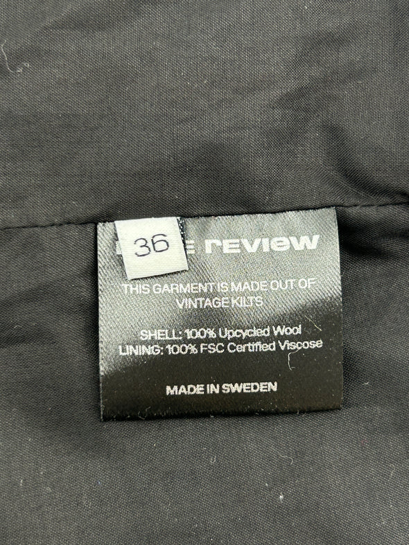 Top zippé à carreaux en laine