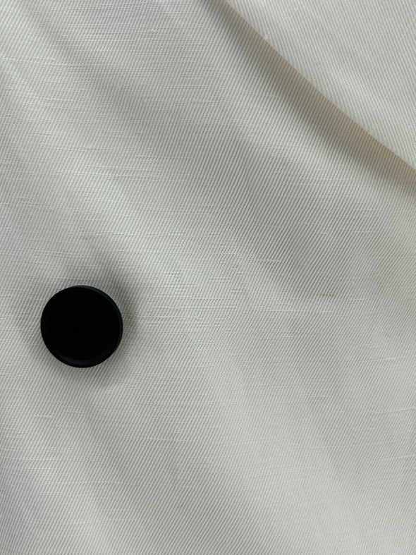 Veste de tailleur blanc à boutons noirs