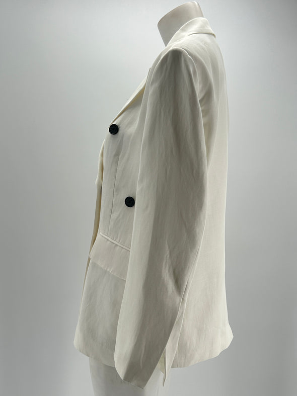 Veste de tailleur blanc à boutons noirs