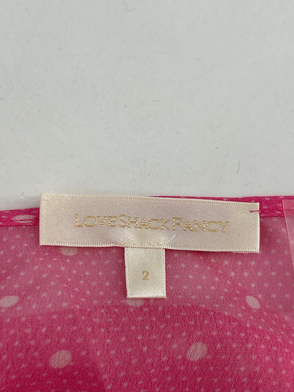 Robe rose à pois blancs en dentelle
