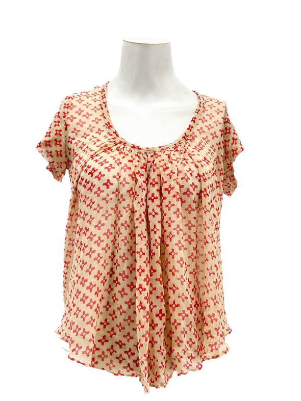 Top beige à motif rouge