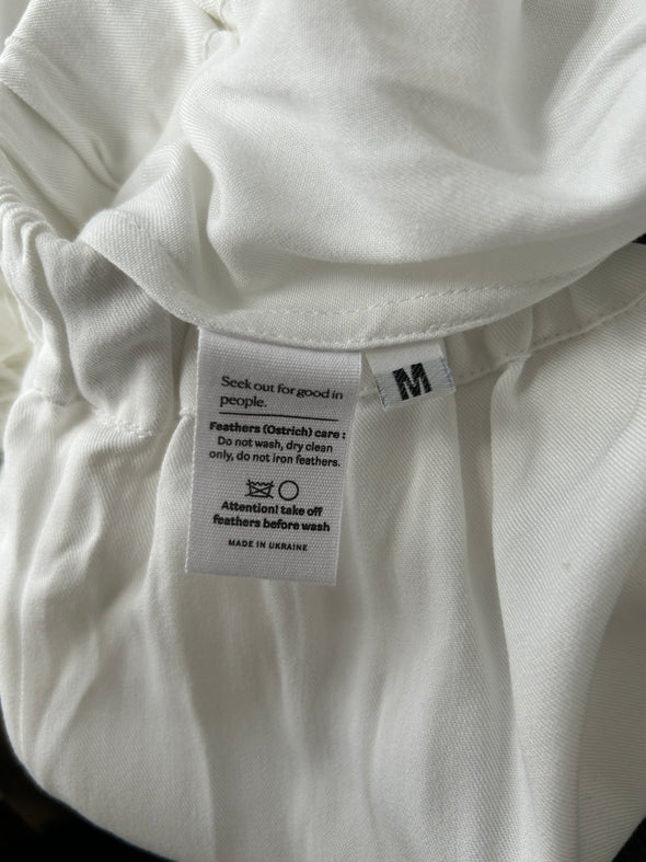 Pantalon blanc à plumes