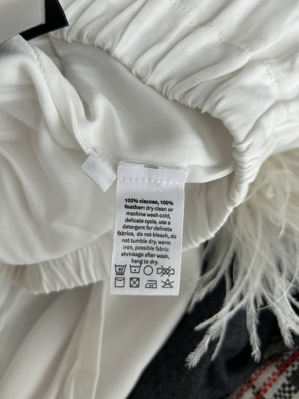 Pantalon blanc à plumes