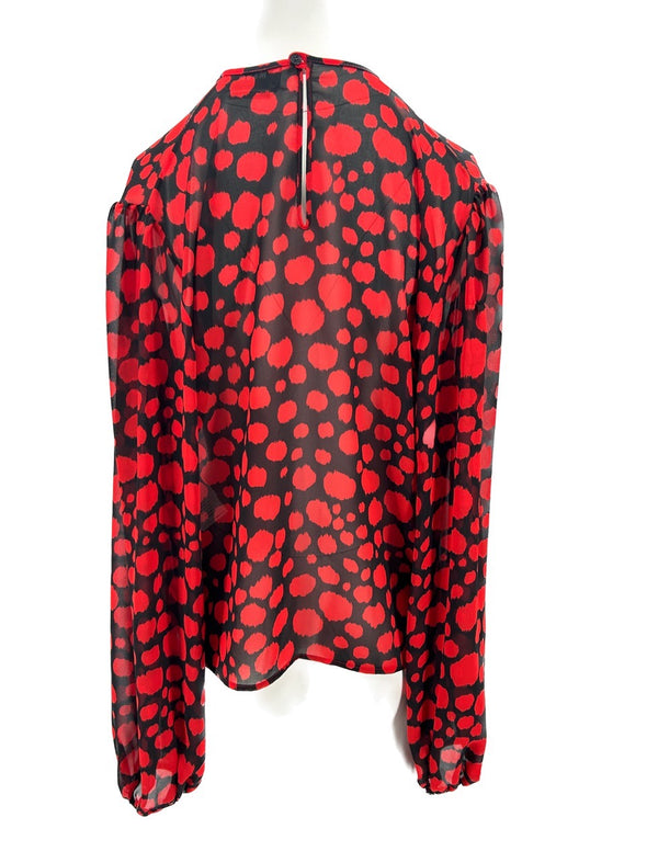 Blouse noire à pois rouges