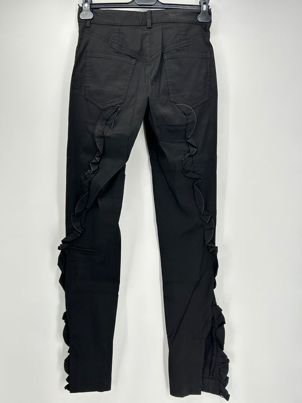 Pantalon noir avec volants sur les côtés