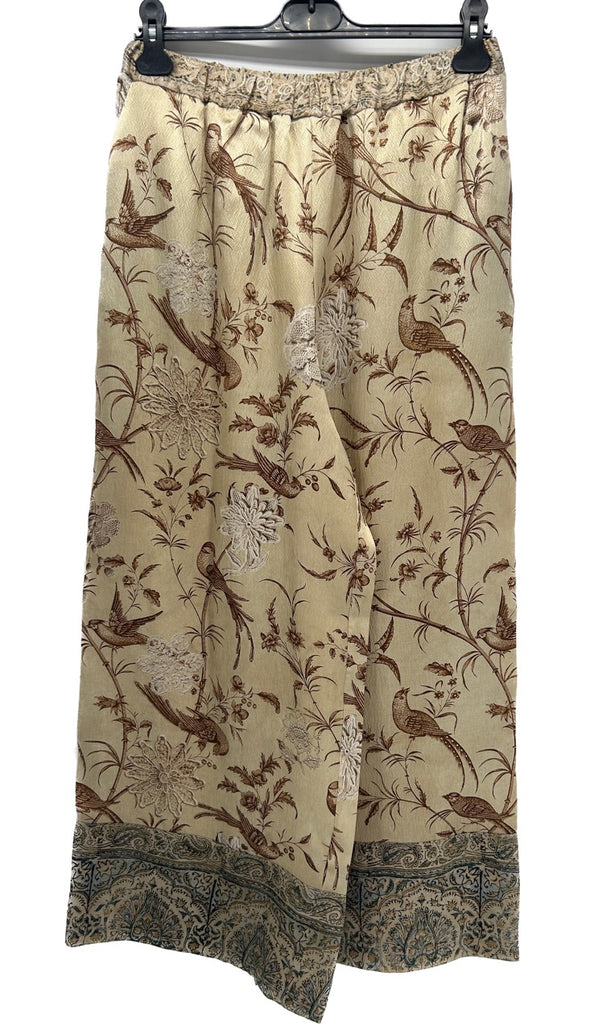 Pantalon fluide beige à motifs oiseaux