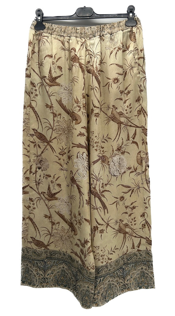 Pantalon fluide beige à motifs oiseaux