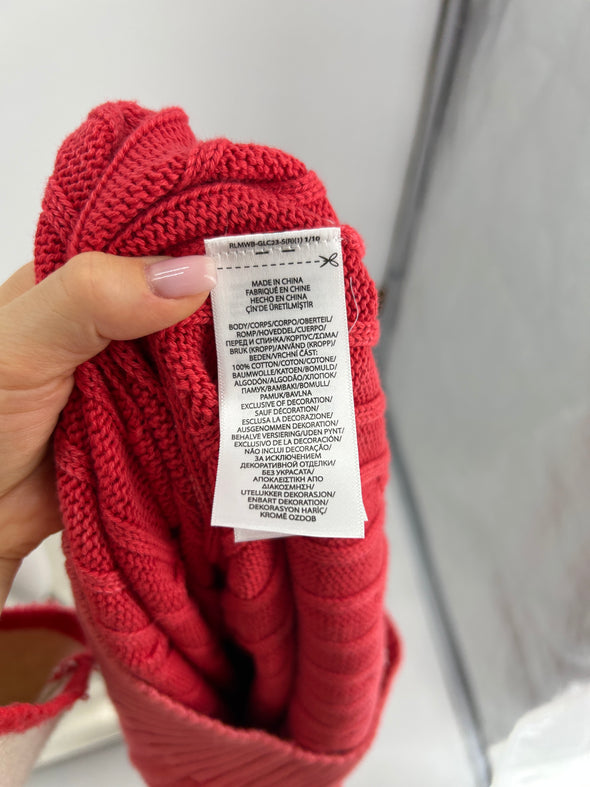 Pull rouge torsadé