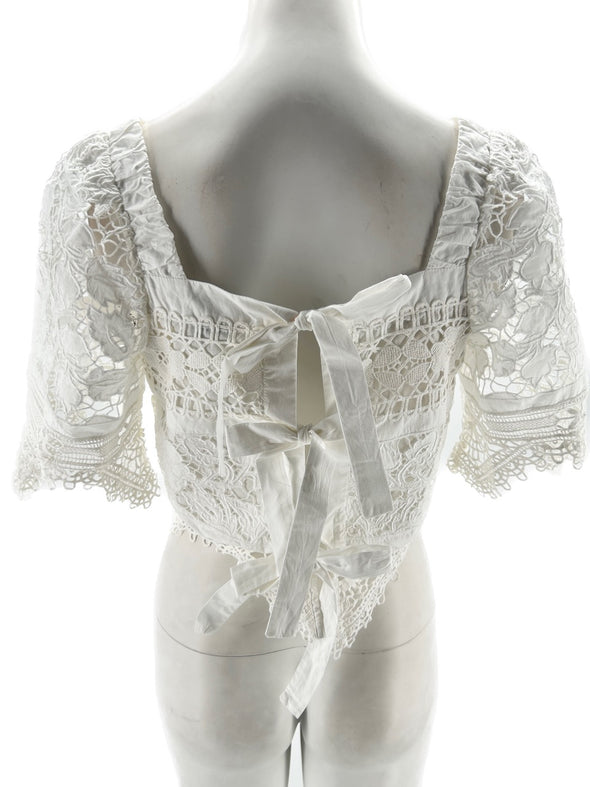 Top blanc en dentelle à nœuds