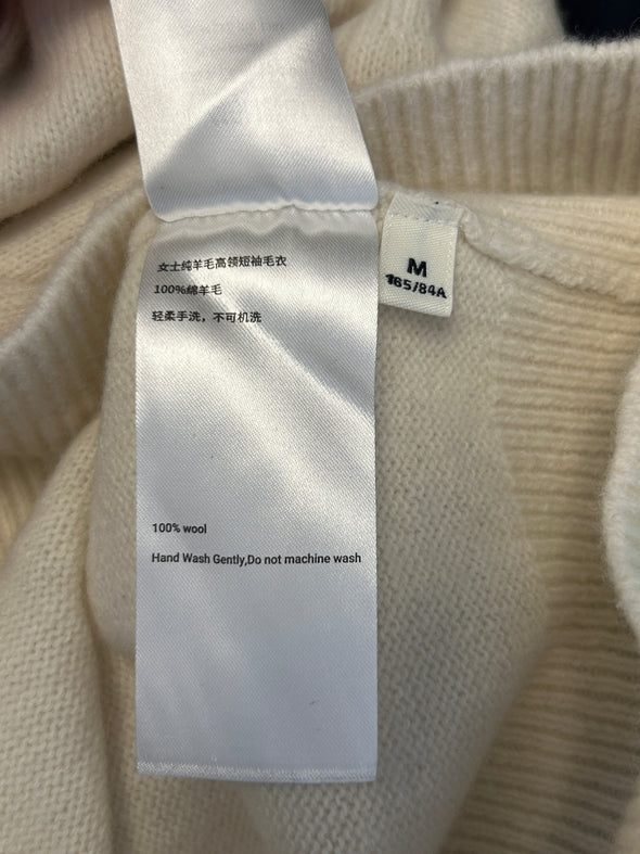 Pull col roulé en laine