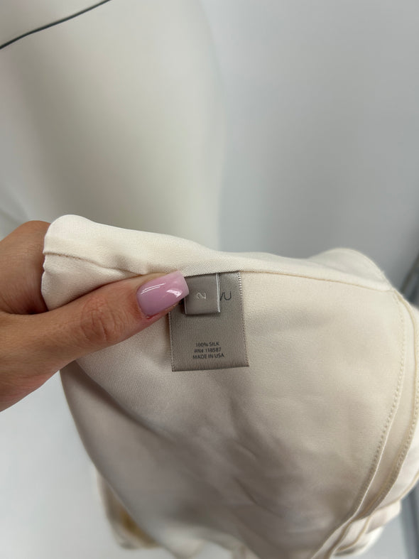 Top beige ceinturé sans manches