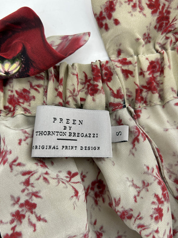 Top beige à volants et imprimé floral