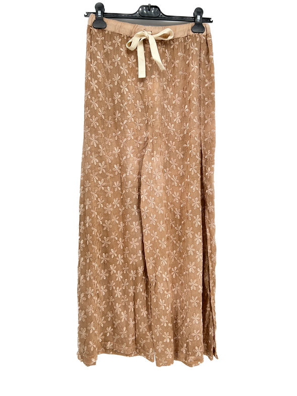 Pantalon fluide beige à imprimé floral