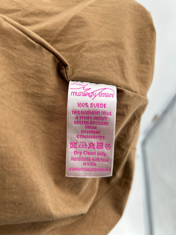 Veste poncho en daim