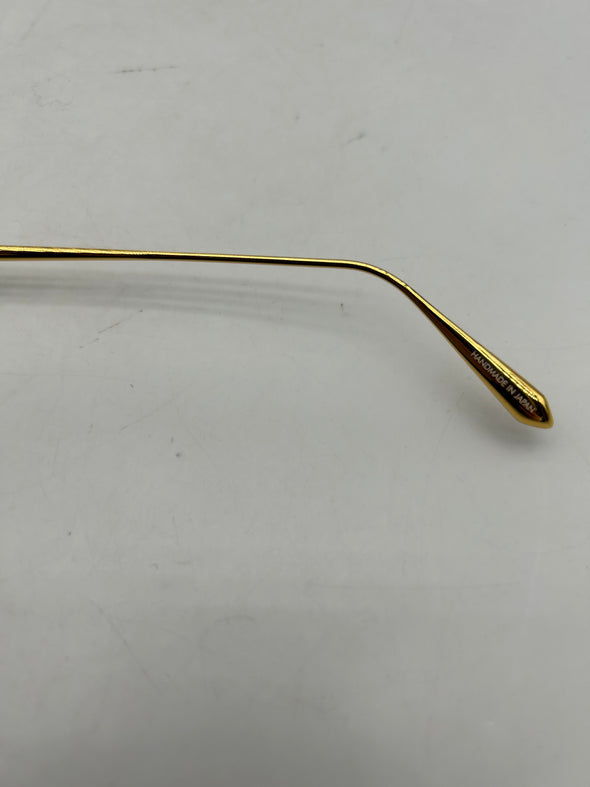 Lunettes de soleil noires et or
