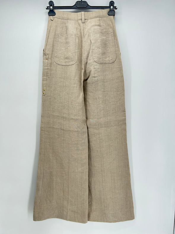 Pantalon en lin beige avec clous dorés