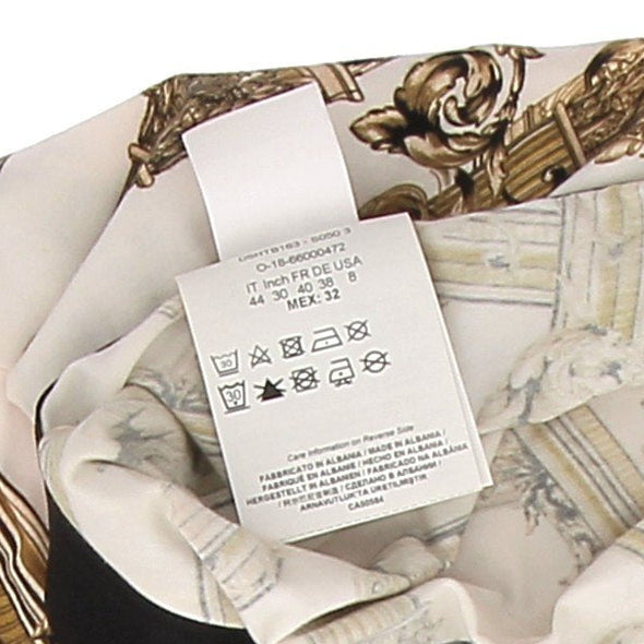 Legging blanc à motifs dorés