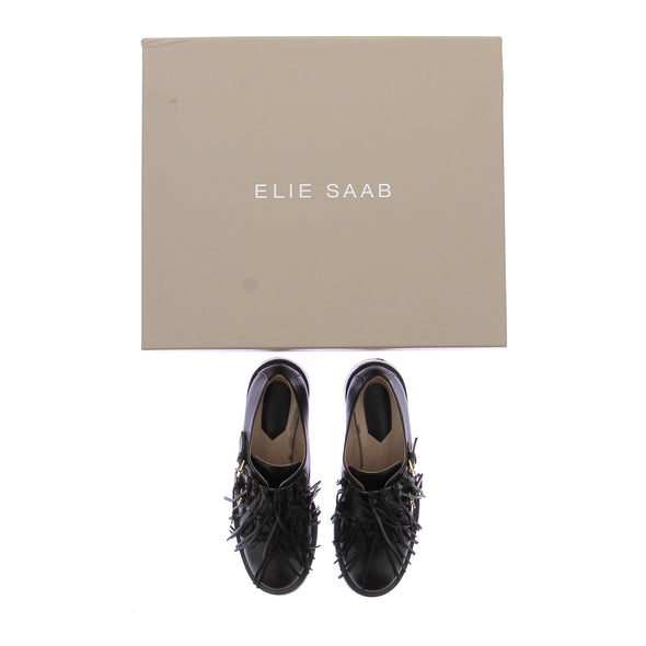 Mocassins en cuir noirs avec franges