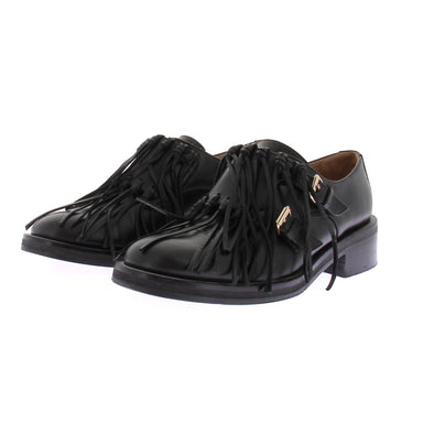 Mocassins en cuir noirs avec franges
