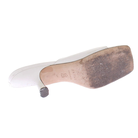 Mules blanches à talons en cuir