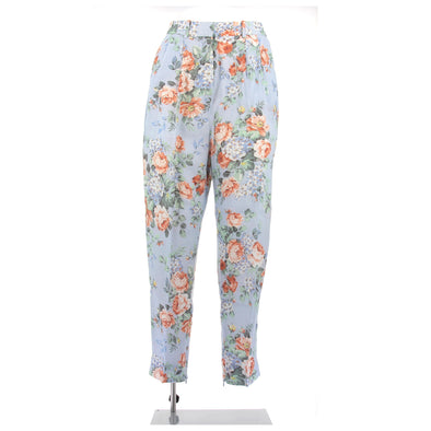 Pantalon bleu fluide à motif fleuri