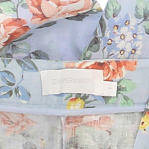 Pantalon bleu fluide à motif fleuri