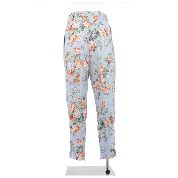 Pantalon bleu fluide à motif fleuri