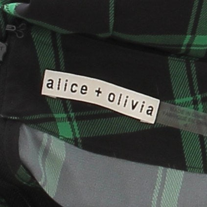 Pantalon à carreaux noirs et verts