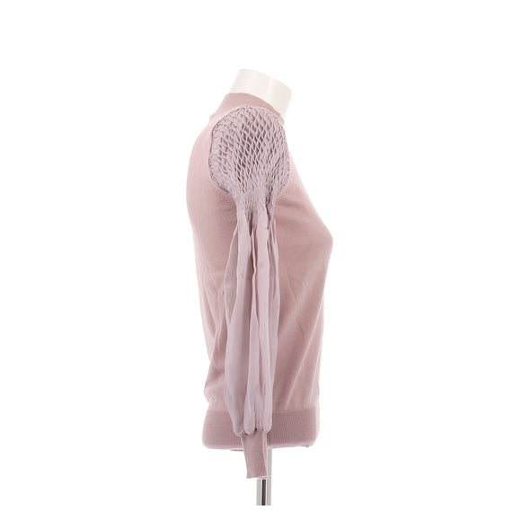 Pull rose à manches smockées