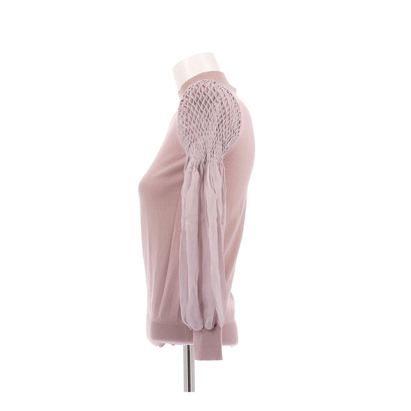 Pull rose à manches smockées