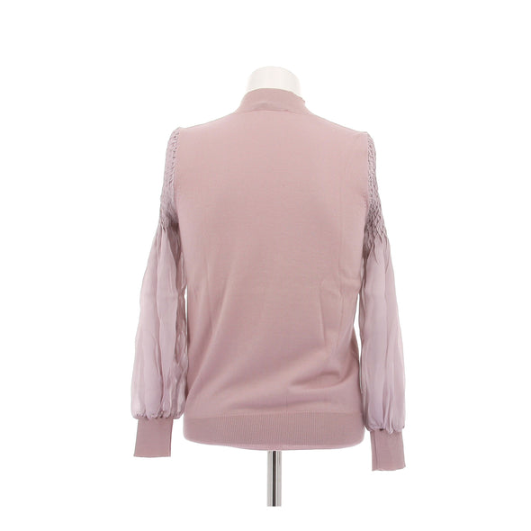 Pull rose à manches smockées