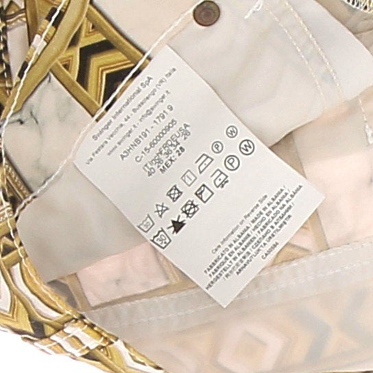 Short blanc à motifs dorés