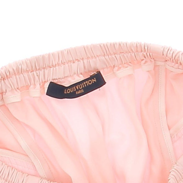 Short satiné rose avec pampilles