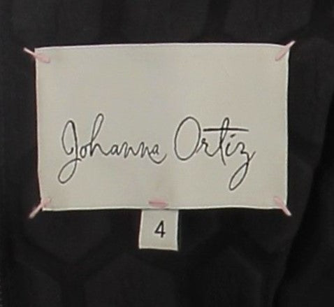 Top noir texturé à manches volumineuses