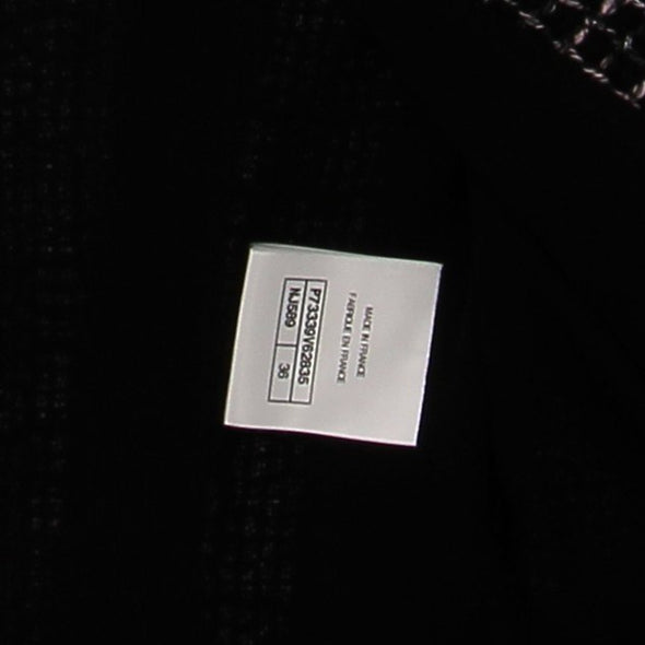 Veste en tweed rose et noire