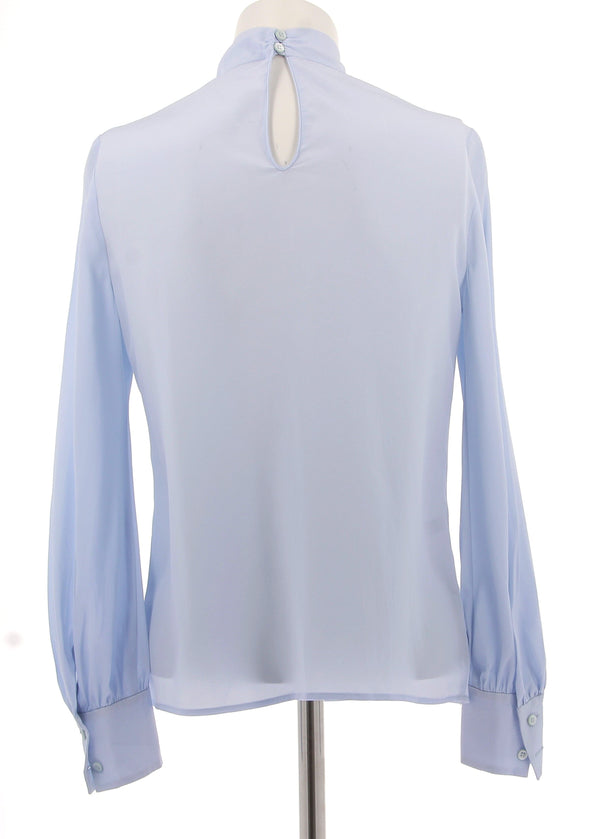 Blouse bleue à nœud