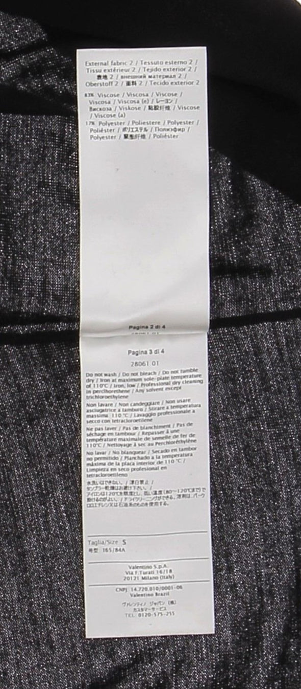 Top noir en dentelle blanche