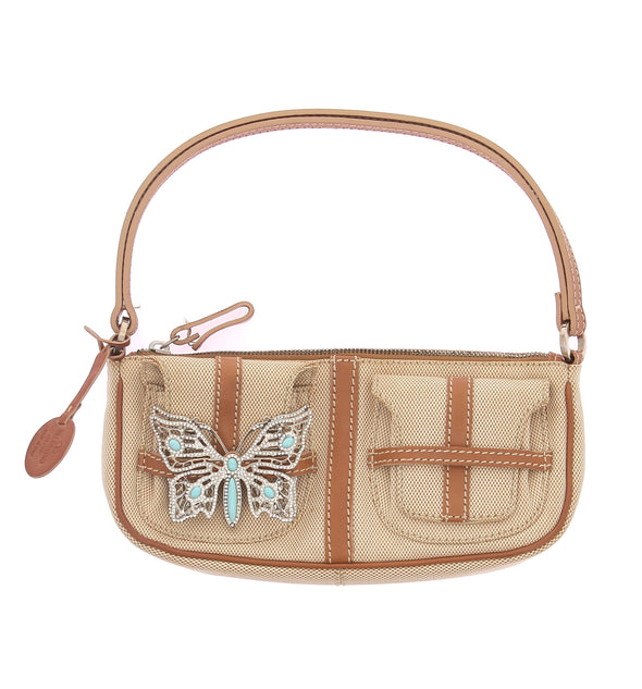 Sac beige avec bijou papillon